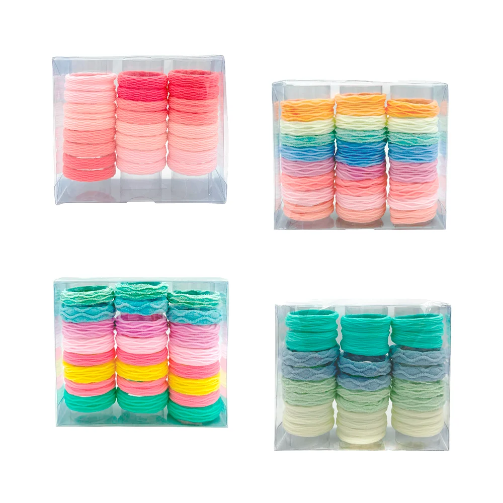 Caja transparente con 24 donas ligas de colores con efecto corrugado …