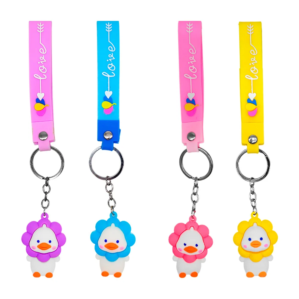 1pza Llavero en forma de pato con flor en la cabeza + banda con frase…