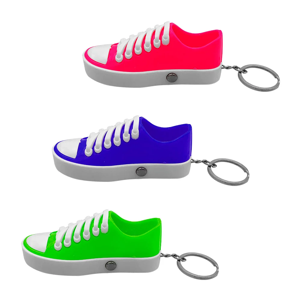 1pza Llavero en forma de tenis plástico bicolor con lámpara pequeña, …