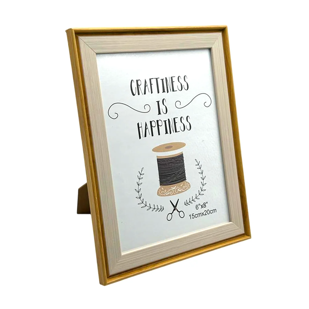 Portarretrato decorativo de 15x20cm con marco diseño tipo madera y bo…