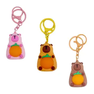 Llavero colgante en forma de capibara con naranja y luz led, variedad…