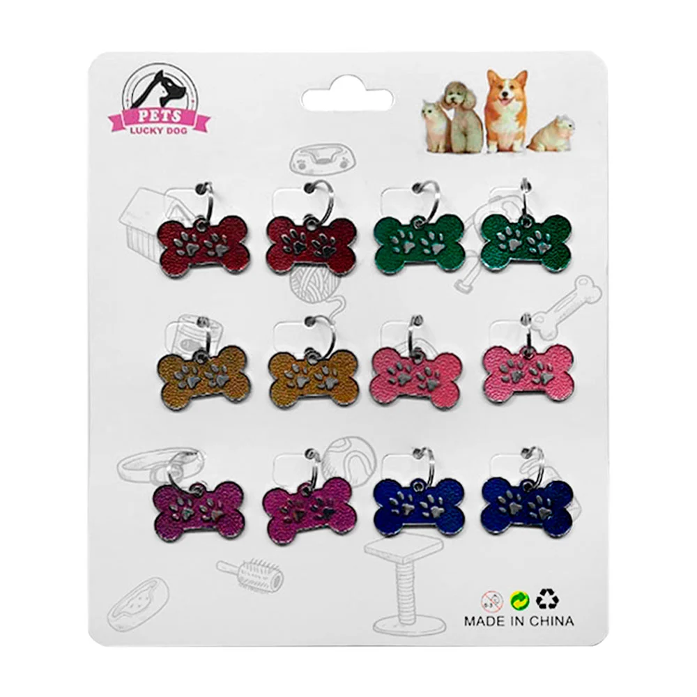 Planilla con 12 placas metálicas para mascotas con relieve de huellas…