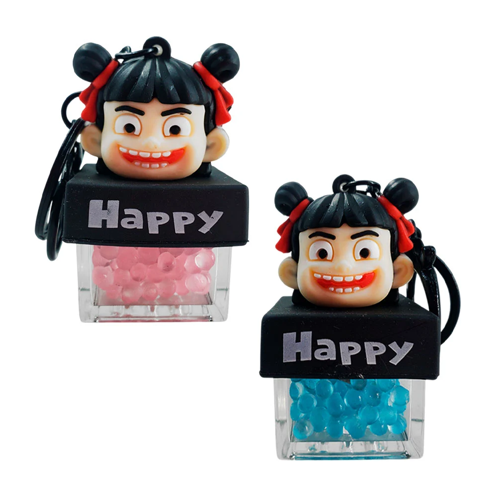Llavero cabeza de muñeca en caja, encapsulado con pedrería + luz / ha…