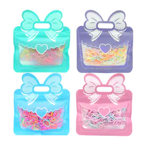 Bolsa tipo ziploc con decoración de moño y mini ligas de latex, color…