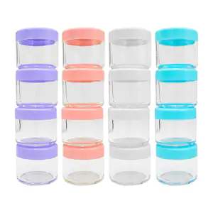Paquete con 4 mini frascos transparentes con tapa de plástico, varied…