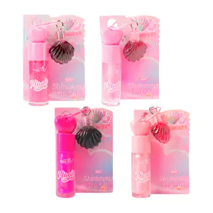 Lip gloss con glitter, tapa de corazón + llavero con tinta en forma d…